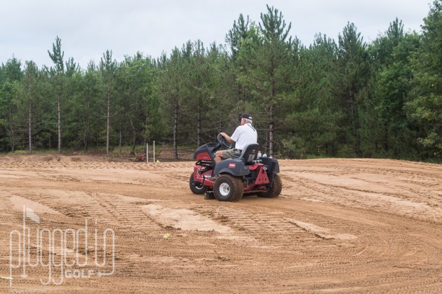 Bill Coore "floating" a green.