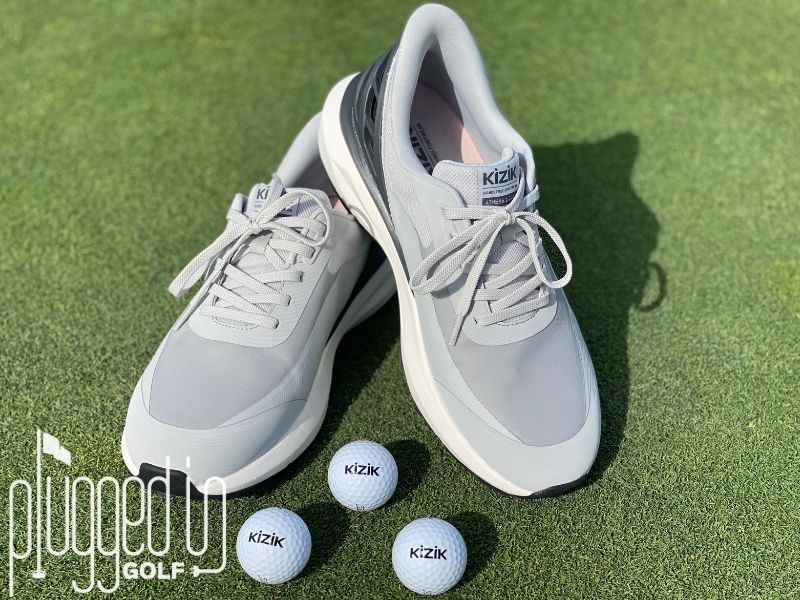 Photo of the Kizik Athens Men's Golf Shoes with three Kizik golfballs in front.
