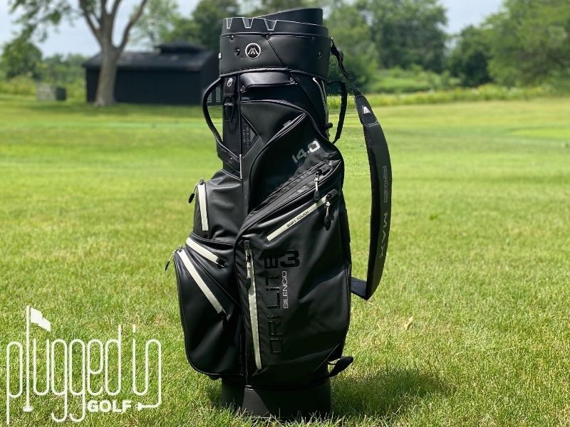 Picture of the BIG MAX Dri Lite Silencio 3 standing vertically in front of a fairway.