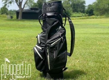 Picture of the BIG MAX Dri Lite Silencio 3 standing vertically in front of a fairway.
