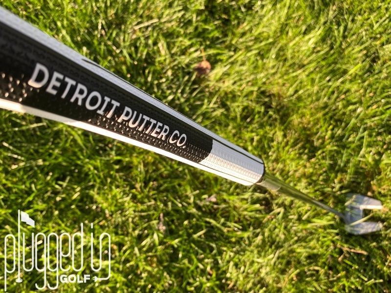 Top down picture of the full The Detroit Putter Co. The Ambassador putter with the color blocking on the pistol grip featured.