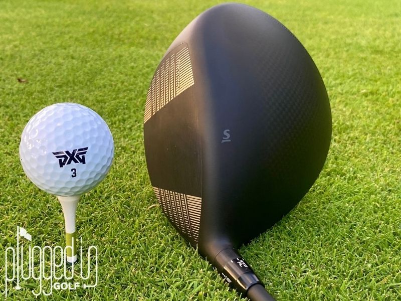 Picture of the RKT Face and Carbon Fiber Crown of the Srixon ZXi RKT LS Driver with a PXG golf ball on a tee.